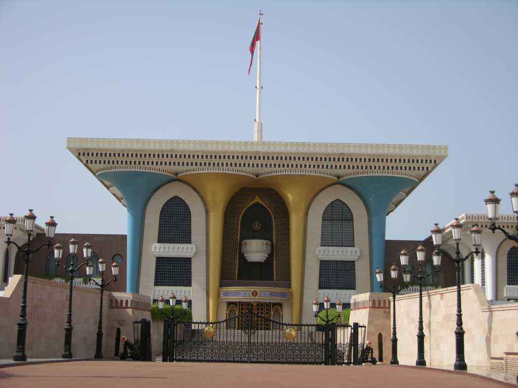 Muscat 02 Muscat 05 Sultan Qaboos Al-Alam Palace Here�s the entrance to the ceremonial Sultan Qaboos Al-Alam Palace in Muscat. Built in 1972, the Al Alam Palace has a fairytale fa�ade of towering gold and blue pillars wrapped in wrought iron and edged in green - is it my imagination or does it look like a plastic pack of golf tees? Sultan Qaboos has ruled Oman since he deposed his father in a 1970 palace coup. After taking power, Sultan Qaboos liberalized politics in Oman and modernized the country�s economy, expanding health care, education, trade, infrastructure, and communications. Qaboos also developed Oman�s oil industry, which has brought prosperity to what was formerly one of Arabia�s poorest countries.